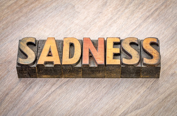 sadness word abstract in wood type