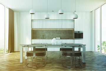 White kitchen with a table toned
