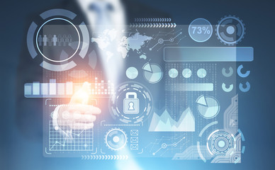 Businessman pointing at HUD and graphs