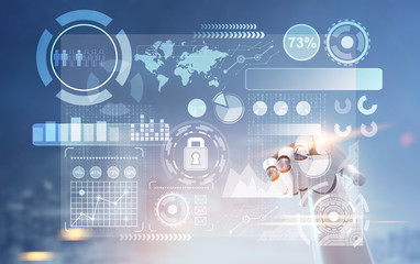 Robot hand pointing at HUD and graphs