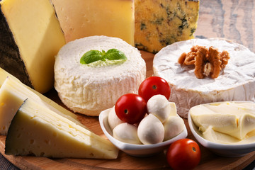 Different sorts of cheese on kitchen table