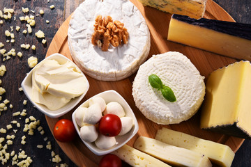 Different sorts of cheese on kitchen table