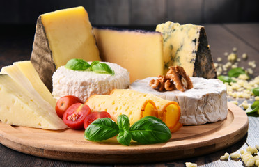 Different sorts of cheese on kitchen table