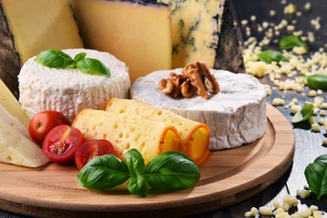 Different sorts of cheese on kitchen table