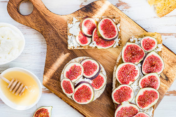 Healthy crackers and toast with figs and ricotta cheese