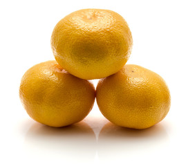 Heap of three tangerines isolated on white background.