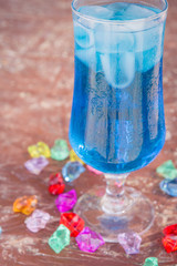Colourful cocktails with ice on the beach in the hot summer