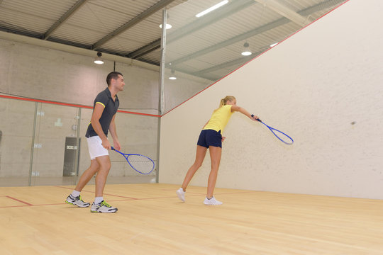 teamwork while playing squash