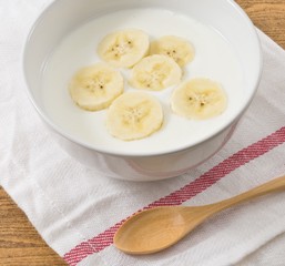 Bowl of Homemade Yoghurt with Ripe Banana