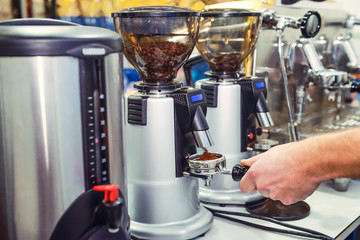 Close up Barista take coffee grind in group, Prepare to brewing espresso shot. Selective focus.