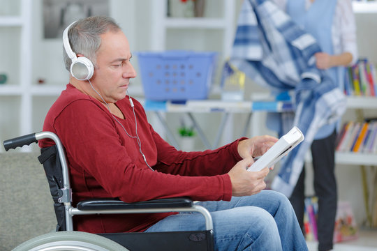 handicapped man wearing headset