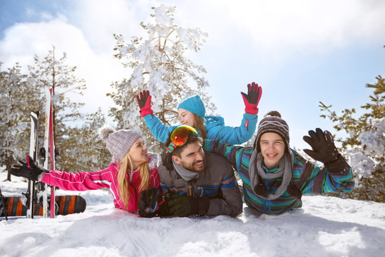 Happy family having fun on snow