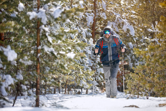 Man hiking in snowy forest