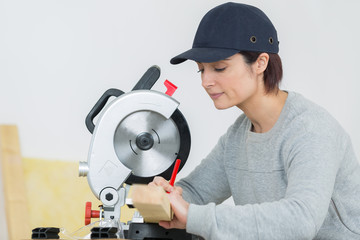 woman aside circular saw