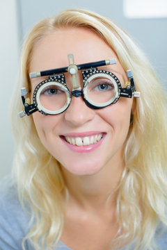 lady wearing opticians testing glasses