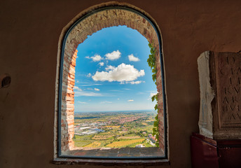 view of Romagna through ancient window