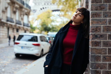 Beauty fashion woman near hause wall on the paris street. Fashion concept outdoor