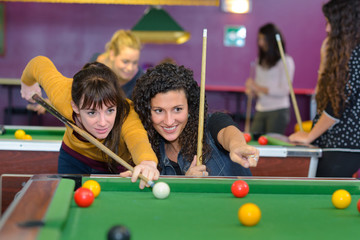 girls playing pool