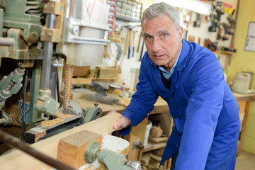 elderly man in his workshop