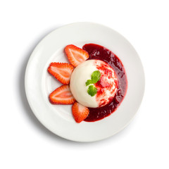 Delicious Italian dessert Panna Cotta with Strawberry, mint and berries sauce in a plate