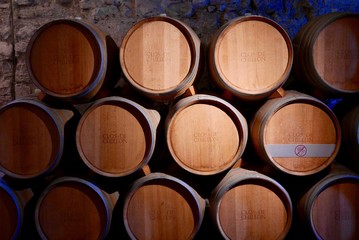 Wine barrels stacked in cellar