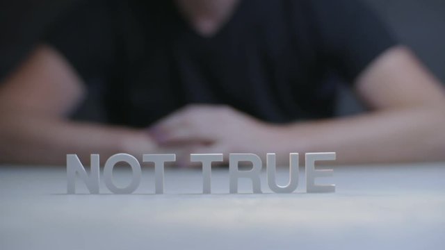 Phrase not true by letters standing on gray background. Concept true or false