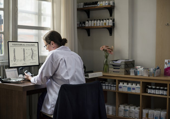 A doctor writing a prescription