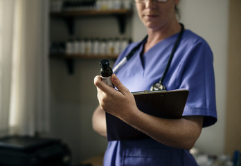 Doctor is checking medicine stock