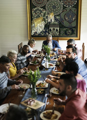 Group of diverse friends are having a dinner together