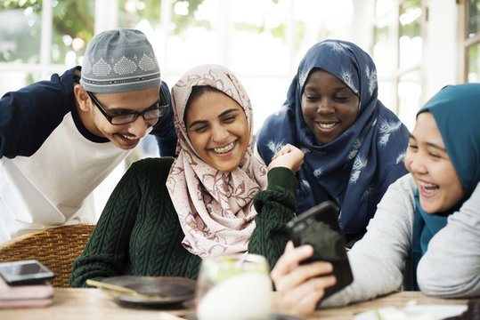 Group of students using mobile phone