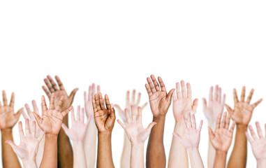 Group of multi-ethnic people's arms outstretched in a white background.