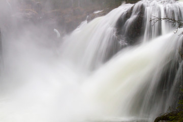 Fototapeta na wymiar Steaming waterfall in the middl of Norway