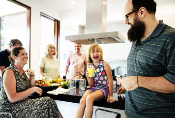 Group of cheerful people in the kitchen