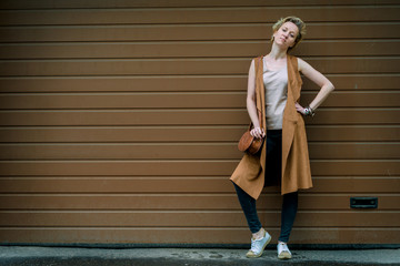 woman on a brown wall background