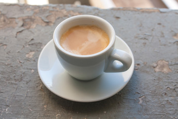 Cup of coffee espresso, top view on grey grunge background