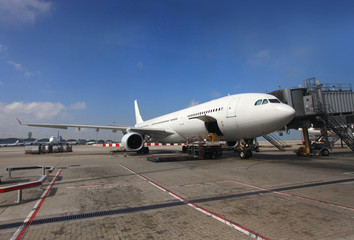 Fototapeta na wymiar An airplane on the ground is preparing for its next flight