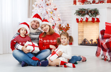 happy family mother father and children on Christmas morning