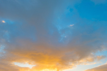 Clouds in a blue sky at sunrise in autumn