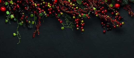 Christmas tree banches and red berries background