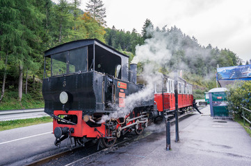 Old retro steam locomotive, black with red. Achensee, Jenbach, Austria.