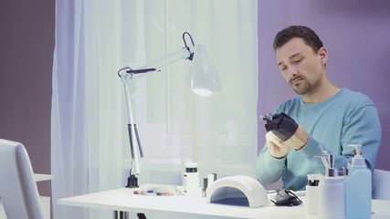 Manicure master wears gloves