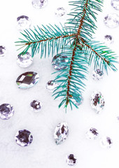 Blue spruce branch with crystals for decoration.