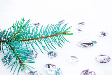 Blue spruce branch with crystals for decoration.
