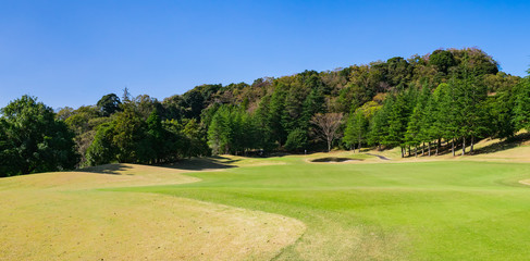 Obraz premium Panorama view of Golf Course where the turf is beautiful and green in Chiba Prefecture, Japan. Golf is a sport to play on the turf