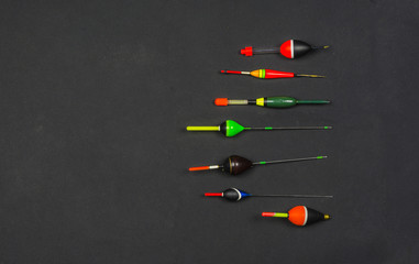Collection of fishing floats in different colors and sizes.