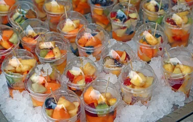 Zelfklevend Fotobehang fresh fruit salad with pieces of fruit and ice cubes © ChiccoDodiFC