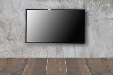lcd tv on concrete wall with wooden floor