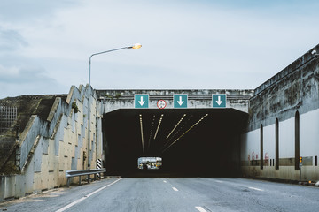 Highway road tunnel with 3 lane and 5.25 meter height limit road sign