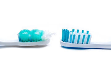 Image of used old and new toothbrushes isolated on a white background