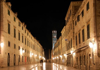 Fototapeta na wymiar Night view on the main street Stradun in Old town of Dubrovnik, Croatia. Many of historic buildings and monuments in Dubrovnik are situated along Stradun